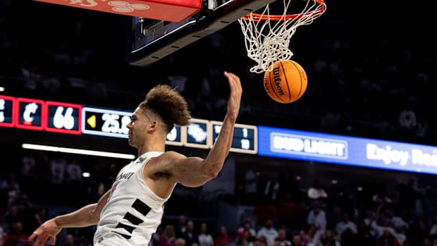 Cincinnati Bearcats guard Dan Skillings Jr. (0) dunks in the second half of the NCAA basketball game between Cincinnati Bearcats and UCF Knights at Fifth Third Arena in Cincinnati on Saturday, Jan. 27, 2024.